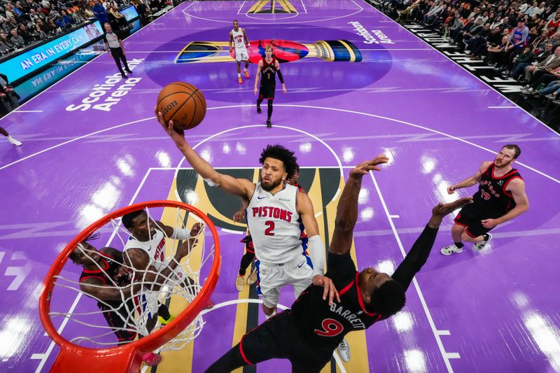 TORONTO, ON - NOVEMBER 15: Cade Cunningham #2 of the Detroit Pistons drives to the basket against RJ Barrett #9 of the Toronto Raptors during the Emirates NBA Cup game at Scotiabank Arena on November 15, 2024 in Toronto, Ontario, Canada. NOTE TO USER: User expressly acknowledges and agrees that, by downloading and/or using this Photograph, user is consenting to the terms and conditions of the Getty Images License Agreement. (Photo by Andrew Lahodynskyj/Getty Images)