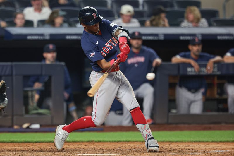 Jul 5, 2024; Bronx, New York, USA; Boston Red Sox center fielder Ceddanne Rafaela (43) hits a two run home run during the tenth inning against the New York Yankees at Yankee Stadium. Mandatory Credit: Vincent Carchietta-USA TODAY Sports