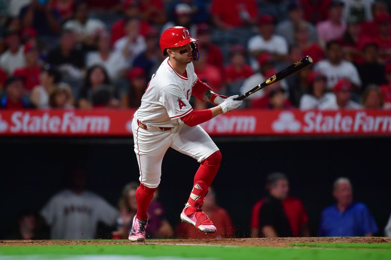 Sep 13, 2024; Anaheim, California, USA; Los Angeles Angels shortstop Zach Neto (9) hits a sacrifice RBI against the Houston Astros during the third inning at Angel Stadium. Mandatory Credit: Gary A. Vasquez-Imagn Images