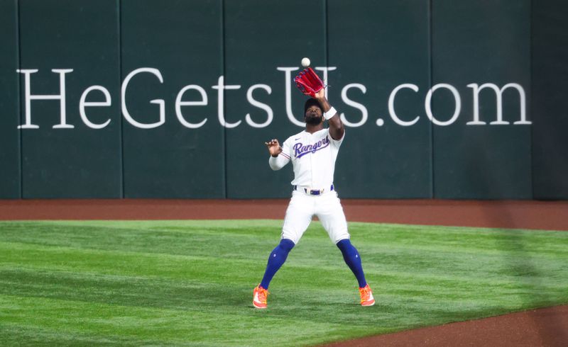 Sep 18, 2024; Arlington, Texas, USA;  Texas Rangers right fielder Adolis Garcia (53) makes a catch during the first inning against the Toronto Blue Jays at Globe Life Field. Mandatory Credit: Kevin Jairaj-Imagn Images