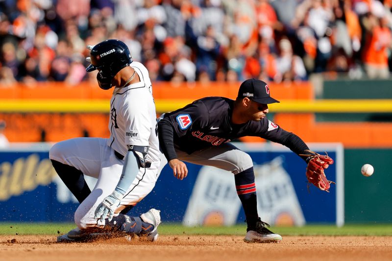 Oct 9, 2024; Detroit, Michigan, USA; Detroit Tigers outfielder Wenceel Perez (46) slides into second base for a double against the Cleveland Guardians during the third inning during game three of the ALDS for the 2024 MLB Playoffs at Comerica Park. Mandatory Credit: Rick Osentoski-Imagn Images