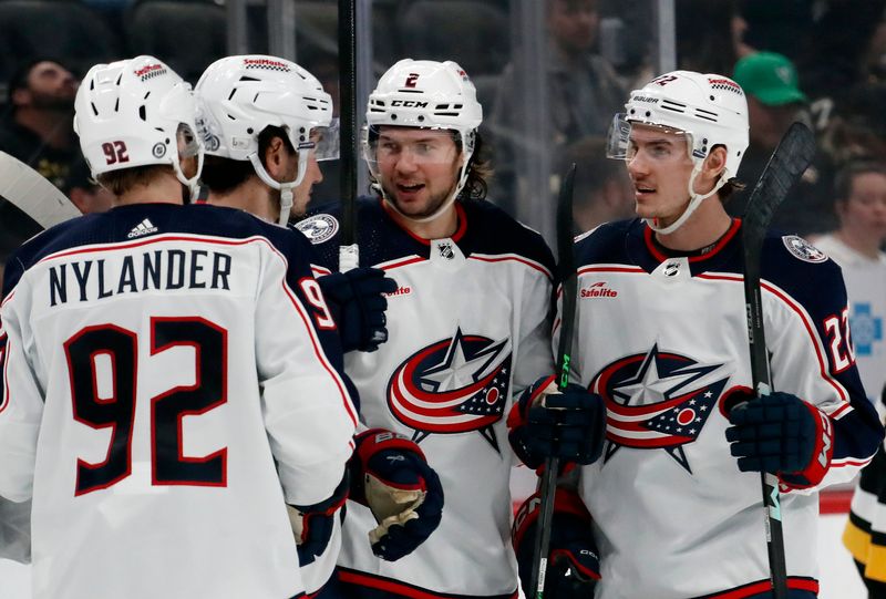 Mar 5, 2024; Pittsburgh, Pennsylvania, USA; Columbus Blue Jackets defenseman Andrew Peeke (2) celebrates his goal with left wing Alexander Nylander (92) and center Alexandre Texier (42) and defenseman Jake Bean (22) against the Pittsburgh Penguins during the second period at PPG Paints Arena. Mandatory Credit: Charles LeClaire-USA TODAY Sports