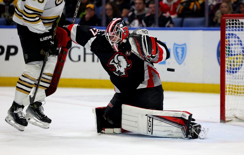 Dec 27, 2023; Buffalo, New York, USA;  Buffalo Sabres goaltender Devon Levi (27) makes a save during the first period against the Boston Bruins at KeyBank Center. Mandatory Credit: Timothy T. Ludwig-USA TODAY Sports