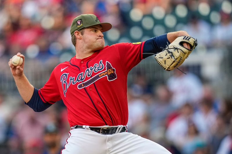 May 19, 2023; Cumberland, Georgia, USA; Atlanta Braves starting pitcher Bryce Elder (55) pitches against the Seattle Mariners during the first inning at Truist Park. Mandatory Credit: Dale Zanine-USA TODAY Sports