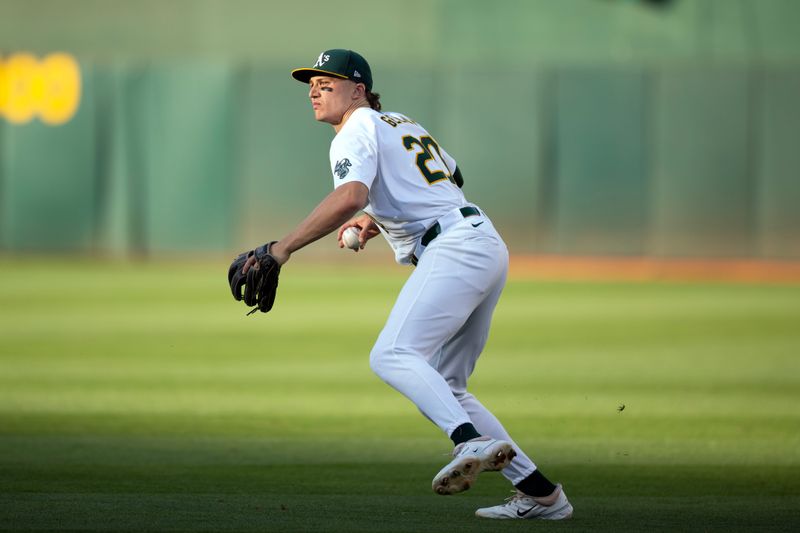 Jul 3, 2024; Oakland, California, USA; Oakland Athletics second baseman Zack Gelof (20) spins and prepares to throw out Los Angeles Angels center fielder Mickey Moniak during the third inning at Oakland-Alameda County Coliseum. Mandatory Credit: D. Ross Cameron-USA TODAY Sports