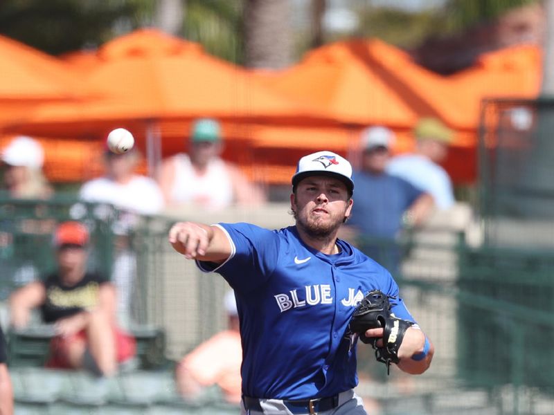 Feb 27, 2025; Sarasota, Florida, USA;  Toronto Blue Jays third base Addison Barger (47) throws the ball for an out at Ed Smith Stadium. Mandatory Credit: Kim Klement Neitzel-Imagn Images