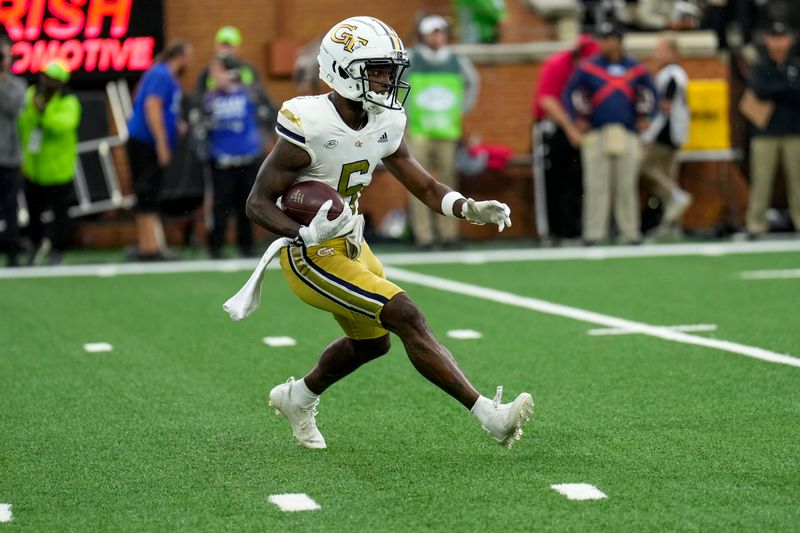 Sep 23, 2023; Winston-Salem, North Carolina, USA; Georgia Tech Yellow Jackets defensive back Clayton Powell-Lee (5) runs back a kick off against the Wake Forest Demon Deacons during the first half at Allegacy Federal Credit Union Stadium. Mandatory Credit: Jim Dedmon-USA TODAY Sports