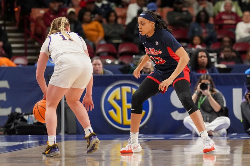 Mar 9, 2024; Greensville, SC, USA; LSU Lady Tigers guard Hailey Van Lith (11) dribbles the ball against Ole Miss Rebels guard Mariyah Noel (13) during the first half at Bon Secours Wellness Arena. Mandatory Credit: Jim Dedmon-USA TODAY Sports