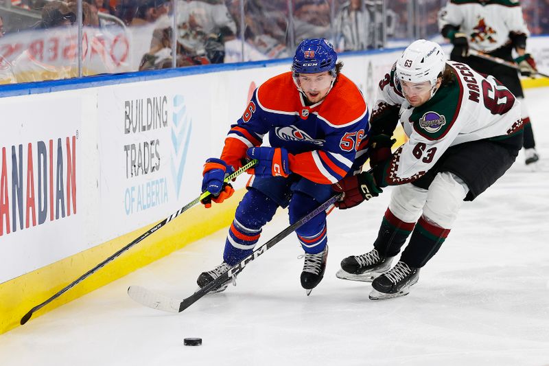 Mar 22, 2023; Edmonton, Alberta, CAN; Edmonton Oilers forward Kailer Yamamoto (56) and Arizona Coyotes forward Matias Maccelli (63) battle for a loose puck during the third period at Rogers Place. Mandatory Credit: Perry Nelson-USA TODAY Sports