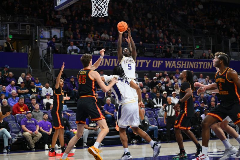 Mar 4, 2026; Seattle, Washington, USA; Washington Huskies guard Zoom Diallo (5) shoots the ball against the Southern California Trojans during the first half at Alaska Airlines Arena at Hec Edmundson Pavilion. Mandatory Credit: Steven Bisig-Imagn Images