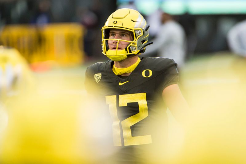 Nov 7, 2020; Eugene, Oregon, USA; Oregon Ducks quarterback Tyler Shough (12) warms up before the start of a game against the Stanford Cardinals at Autzen Stadium. Mandatory Credit: Troy Wayrynen-USA TODAY Sports