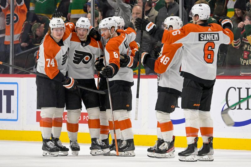 Jan 12, 2024; Saint Paul, Minnesota, USA; Philadelphia Flyers forward Joel Farabee (86) is congratulated on his game-winning power play goal against the Minnesota Wild in overtime with forward Owen Tippett (74) and defenseman Cam York (8) at Xcel Energy Center. Mandatory Credit: Nick Wosika-USA TODAY Sports