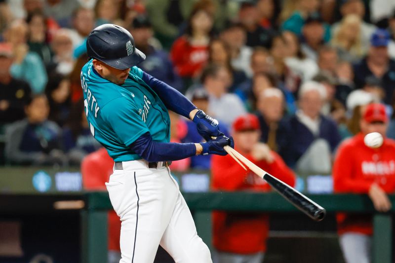 Sep 12, 2023; Seattle, Washington, USA; Seattle Mariners designated hitter Sam Haggerty (0) breaks his bat while hitting a single against the Los Angeles Angels during the fourth inning at T-Mobile Park. Mandatory Credit: Joe Nicholson-USA TODAY Sports