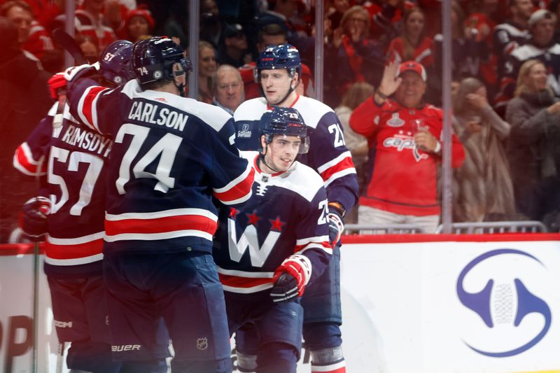 Mar 9, 2024; Washington, District of Columbia, USA; Washington Capitals center Hendrix Lapierre (29) celebrates with teammates after scoring a goal against the Chicago Blackhawks in the first period at Capital One Arena. Mandatory Credit: Geoff Burke-USA TODAY Sports