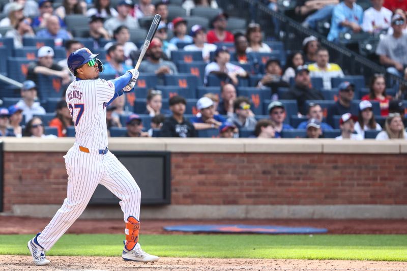 Apr 28, 2024; New York City, New York, USA;  New York Mets third baseman Mark Vientos (27) hits a game winning two run home run in the 11th inning to defeat the St. Louis Cardinals 4-2 at Citi Field. Mandatory Credit: Wendell Cruz-USA TODAY Sports