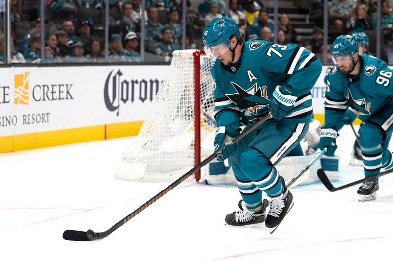 Oct 10, 2024; San Jose, California, USA;  San Jose Sharks center Tyler Toffoli (73) controls the puck during the third period against the St. Louis Blues at SAP Center at San Jose. Mandatory Credit: Stan Szeto-Imagn Images