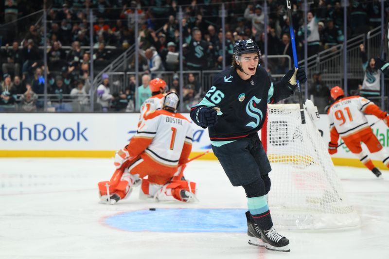 Oct 9, 2025; Seattle, Washington, USA; Seattle Kraken center Ryan Winterton (26) celebrates after a goal scored by Seattle Kraken left wing Mason Marchment (27) (not pictured) during the second period against the Anaheim Ducks at Climate Pledge Arena. Mandatory Credit: Steven Bisig-Imagn Images