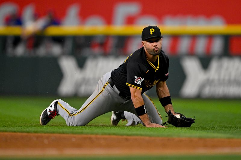 Aug 21, 2024; Arlington, Texas, USA; Pittsburgh Pirates second baseman Isiah Kiner-Falefa (7) fields a ball hit by Texas Rangers catcher Jonah Heim (not pictured) during the ninth inning at Globe Life Field. Mandatory Credit: Jerome Miron-USA TODAY Sports