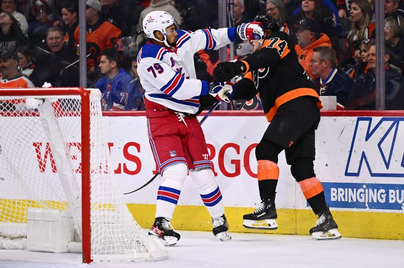 Nov 24, 2023; Philadelphia, Pennsylvania, USA; New York Rangers defenseman K'Andre Miller (79) hits Philadelphia Flyers right wing Owen Tippett (74) in the second period at Wells Fargo Center. Mandatory Credit: Kyle Ross-USA TODAY Sports