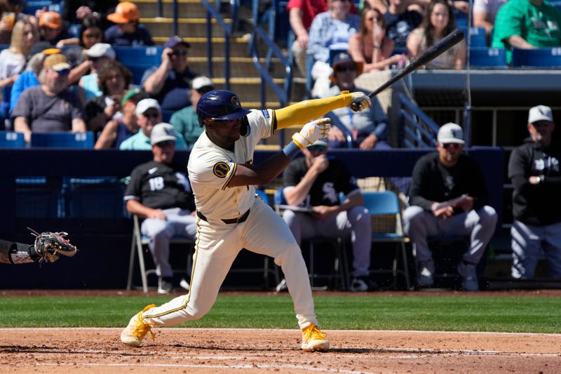 Mar 13, 2024; Phoenix, Arizona, USA; Milwaukee Brewers shortstop Andrew Monasterio (14) hits against the Chicago White Sox in the third inning at American Family Fields of Phoenix. Mandatory Credit: Rick Scuteri-USA TODAY Sports