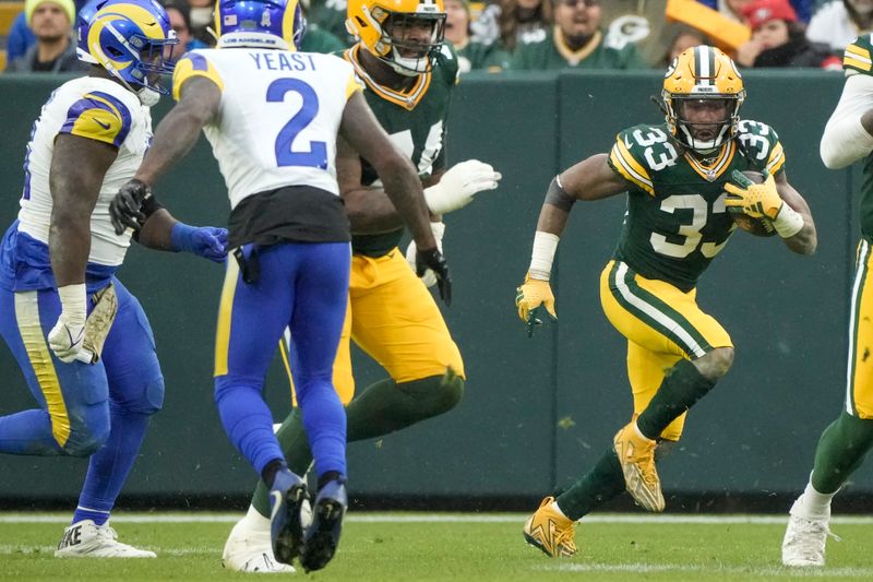 Green Bay Packers' Aaron Jones runs during the second half of an NFL football game against the Los Angeles Rams Sunday, Nov. 5, 2023, in Green Bay, Wis. (AP Photo/Morry Gash)