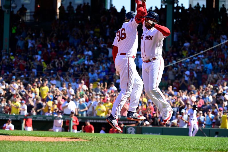 Aug 27, 2023; Boston, Massachusetts, USA; Boston Red Sox first baseman Triston Casas (36) celebrates a two-run home run against the Los Angeles Dodgers with third base coach Carlos Febles (53) during the sixth inning at Fenway Park. Mandatory Credit: Eric Canha-USA TODAY Sports