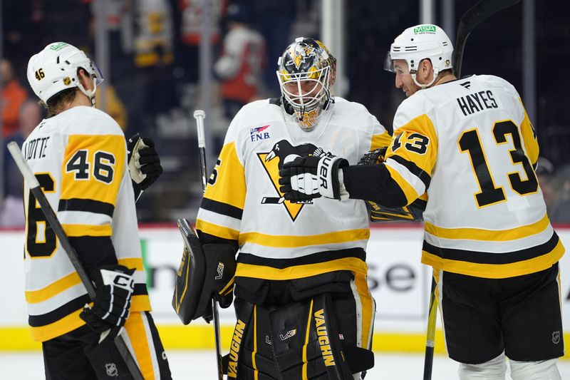 Dec 1, 2025; Philadelphia, Pennsylvania, USA; Pittsburgh Penguins goalie Tristan Jarry (35) reacts with right wing Kevin Hayes (13) and center Blake Lizotte (46) after the game against the Philadelphia Flyers at Xfinity Mobile Arena. Mandatory Credit: Kyle Ross-Imagn Images