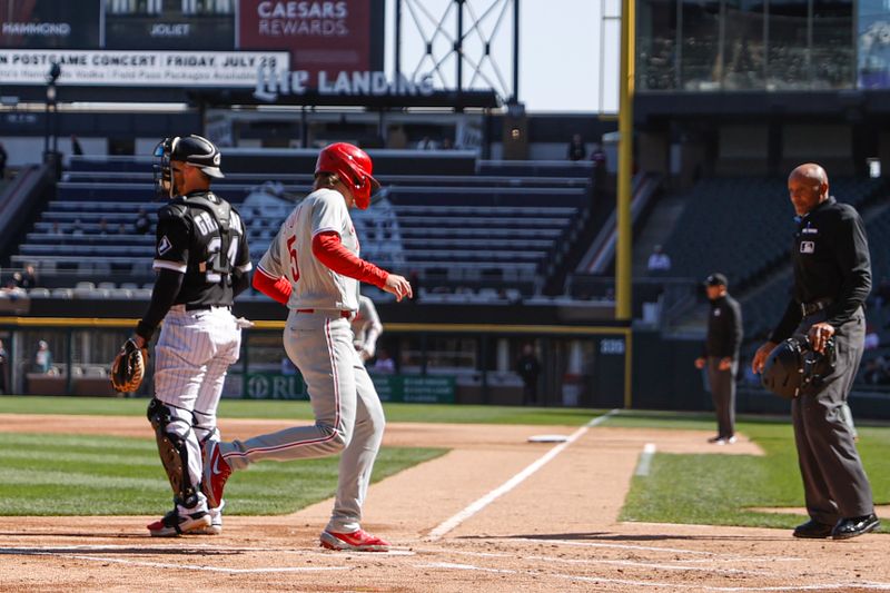 Apr 18, 2023; Chicago, Illinois, USA; Philadelphia Phillies second baseman Bryson Stott (5) scores against the Chicago White Sox during the first inning of game one of the doubleheader at Guaranteed Rate Field. Mandatory Credit: Kamil Krzaczynski-USA TODAY Sports