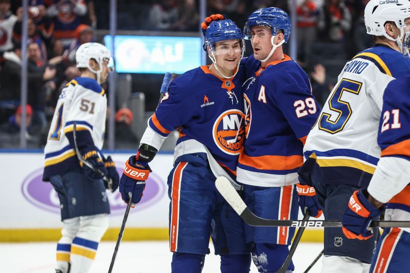 Nov 23, 2024; Elmont, New York, USA;  New York Islanders center Brock Nelson (29) celebrates with right wing Maxim Tsyplakov (7) after scoring a goal in the second period against the St. Louis Blues at UBS Arena. Mandatory Credit: Wendell Cruz-Imagn Images