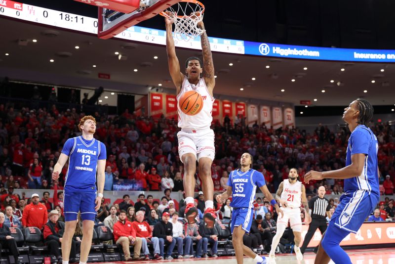 Dec 29, 2025; Houston, Texas, USA; Houston Cougars forward Chris Cenac Jr. (5) dunks the ball during the first half against the Middle Tennessee Blue Raiders at Fertitta Center. Mandatory Credit: Troy Taormina-Imagn Images