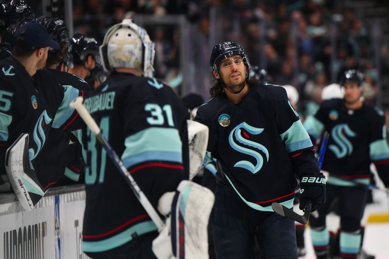 Apr 9, 2024; Seattle, Washington, USA; Seattle Kraken left wing Brandon Tanev (13) celebrates with the bench after scoring a goal against the Arizona Coyotes during the third period at Climate Pledge Arena. Mandatory Credit: Steven Bisig-USA TODAY Sports