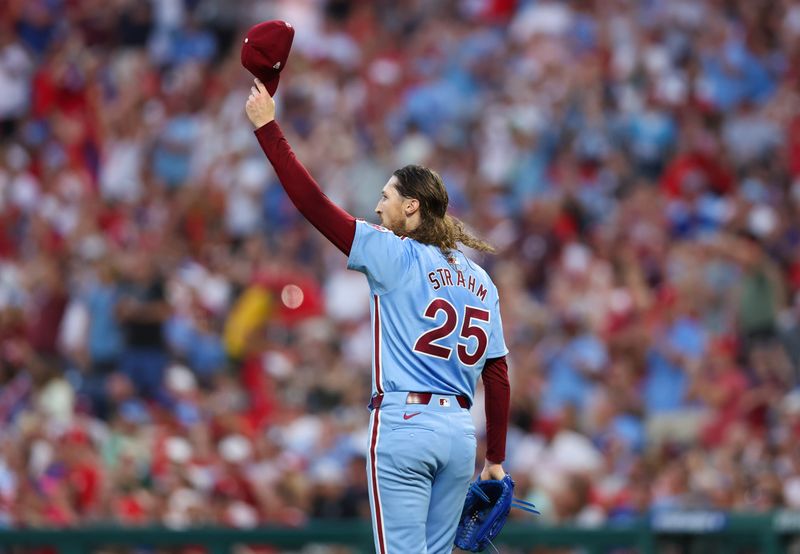 Jul 11, 2024; Philadelphia, Pennsylvania, USA; Philadelphia Phillies pitcher Matt Strahm (25) reacts to an acrobatic catch for an out by outfielder Johan Rojas (not pictured) during the seventh inning against the Los Angeles Dodgers at Citizens Bank Park. Mandatory Credit: Bill Streicher-USA TODAY Sports