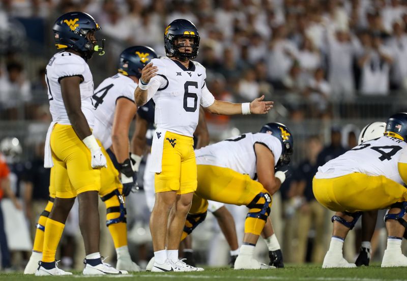 Sep 2, 2023; University Park, Pennsylvania, USA; West Virginia Mountaineers quarterback Garrett Greene (6) reacts at the line of scrimmage during the second quarter against the Penn State Nittany Lions at Beaver Stadium. Mandatory Credit: Matthew O'Haren-USA TODAY Sports