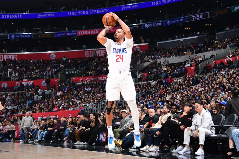 LOS ANGELES, CA - APRIL 4: Norman Powell #24 of the LA Clippers shoots the ball during the game against the Denver Nuggets on April 4, 2024 at Crypto.Com Arena in Los Angeles, California. NOTE TO USER: User expressly acknowledges and agrees that, by downloading and/or using this Photograph, user is consenting to the terms and conditions of the Getty Images License Agreement. Mandatory Copyright Notice: Copyright 2024 NBAE (Photo by Adam Pantozzi/NBAE via Getty Images)