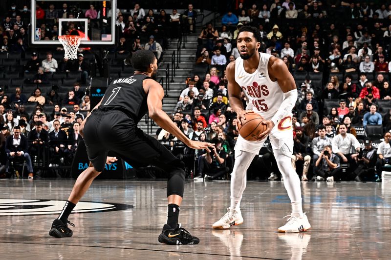 BROOKLYN, NY - FEBRUARY 8: Donovan Mitchell #45 of the Cleveland Cavaliers looks to pass the ball during the game against the Brooklyn Nets on February 8, 2024 at the Barclays Center in Brooklyn, New York. NOTE TO USER: User expressly acknowledges and agrees that, by downloading and/or using this Photograph, user is consenting to the terms and conditions of the Getty Images License Agreement. Mandatory Copyright Notice: Copyright 2024 NBAE (Photo by David Dow/NBAE via Getty Images)