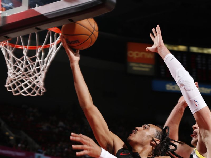 PORTLAND, OR - DECEMBER 6: Dalano Banton #5 of the Portland Trail Blazers drives to the basket during the game against the Utah Jazz on December 6, 2024 at the Moda Center Arena in Portland, Oregon. NOTE TO USER: User expressly acknowledges and agrees that, by downloading and or using this photograph, user is consenting to the terms and conditions of the Getty Images License Agreement. Mandatory Copyright Notice: Copyright 2024 NBAE (Photo by Cameron Browne/NBAE via Getty Images)