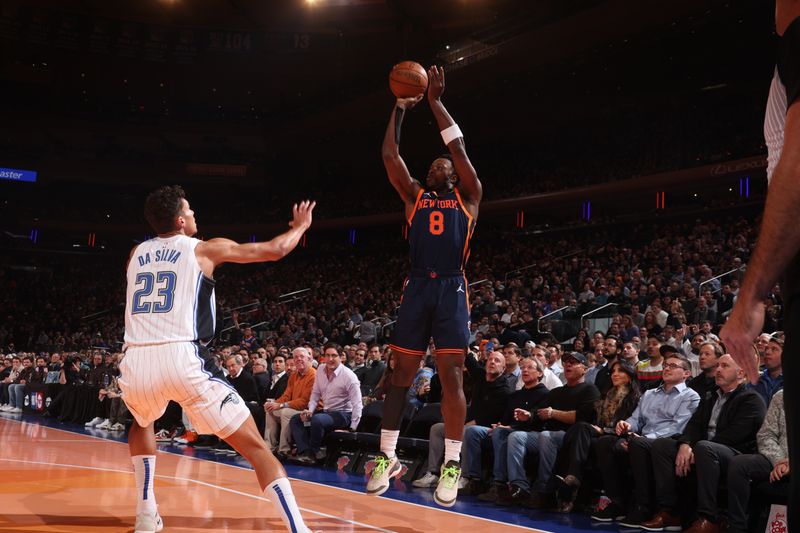 NEW YORK, NY - DECEMBER 3: OG Anunoby #8 of the New York Knicks shoots a three point basket during the game  against the Orlando Magic during the Emirates NBA Cup on December 3, 2024 at Madison Square Garden in New York City, New York.  NOTE TO USER: User expressly acknowledges and agrees that, by downloading and or using this photograph, User is consenting to the terms and conditions of the Getty Images License Agreement. Mandatory Copyright Notice: Copyright 2024 NBAE  (Photo by Nathaniel S. Butler/NBAE via Getty Images)