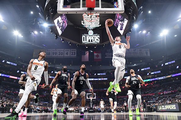 LOS ANGELES, CA - DECEMBER 6: Christian Braun #0 of the Denver Nuggets goes to the basket during the game on December 6, 2023 at Crypto.Com Arena in Los Angeles, California. NOTE TO USER: User expressly acknowledges and agrees that, by downloading and/or using this Photograph, user is consenting to the terms and conditions of the Getty Images License Agreement. Mandatory Copyright Notice: Copyright 2023 NBAE (Photo by Adam Pantozzi/NBAE via Getty Images)