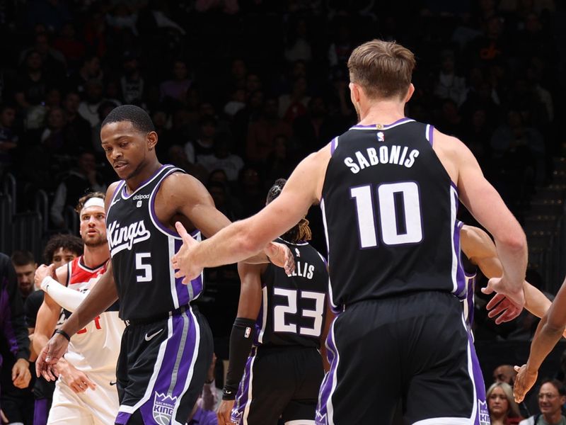 WASHINGTON, DC -? MARCH 21: De'Aaron Fox #5 of the Sacramento Kings high fives Domantas Sabonis #10 during the game against the Washington Wizards on March 21, 2024 at Capital One Arena in Washington, DC. NOTE TO USER: User expressly acknowledges and agrees that, by downloading and or using this Photograph, user is consenting to the terms and conditions of the Getty Images License Agreement. Mandatory Copyright Notice: Copyright 2024 NBAE (Photo by Stephen Gosling/NBAE via Getty Images)