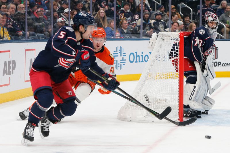 Dec 16, 2025; Columbus, Ohio, USA; Columbus Blue Jackets defenseman Denton Mateychuk (5) passes the puck as Anaheim Ducks left wing Ross Johnston (44) trails the play during the first period at Nationwide Arena. Mandatory Credit: Russell LaBounty-Imagn Images