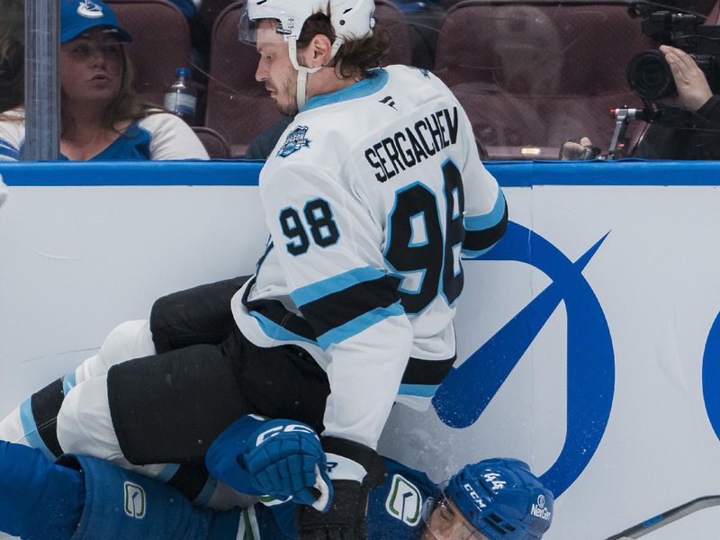 Mar 16, 2025; Vancouver, British Columbia, CAN; Utah Hockey Club defenseman Mikhail Sergachev (98) collides with Vancouver Canucks forward Kiefer Sherwood (44) in the first period at Rogers Arena. Mandatory Credit: Bob Frid-Imagn Images