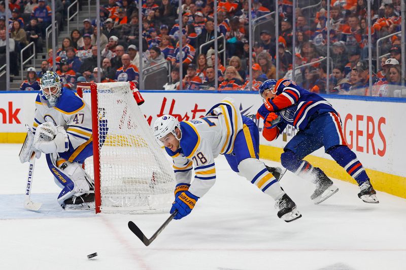 Jan 25, 2025; Edmonton, Alberta, CAN; Buffalo Sabres defensemen Jacob Bryson (78) and Edmonton Oilers forward Jeff Skinner (53) both fall while chasing a loose puck during the third period at Rogers Place. Mandatory Credit: Perry Nelson-Imagn Images