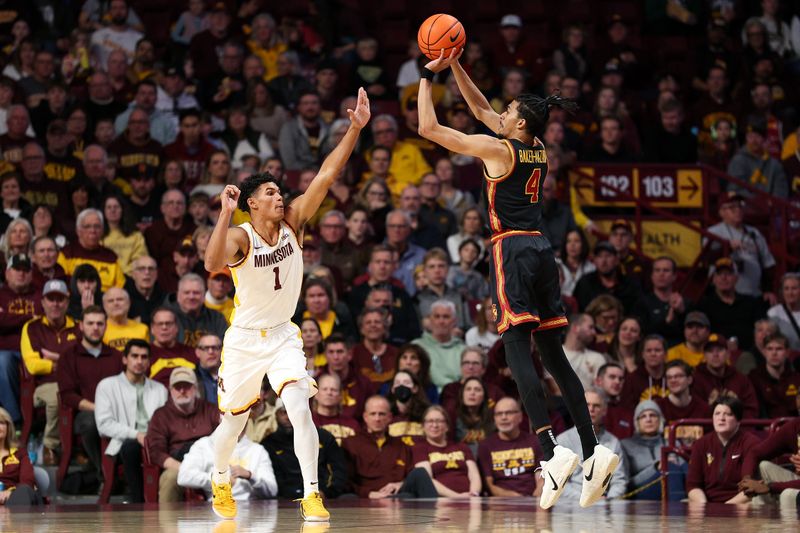 Jan 9, 2026; Minneapolis, Minnesota, USA; Southern California Trojans forward Chad Baker-Mazara (4) shoots over Minnesota Golden Gophers guard Isaac Asuma (1) during the first half at Williams Arena. Mandatory Credit: Matt Krohn-Imagn Images