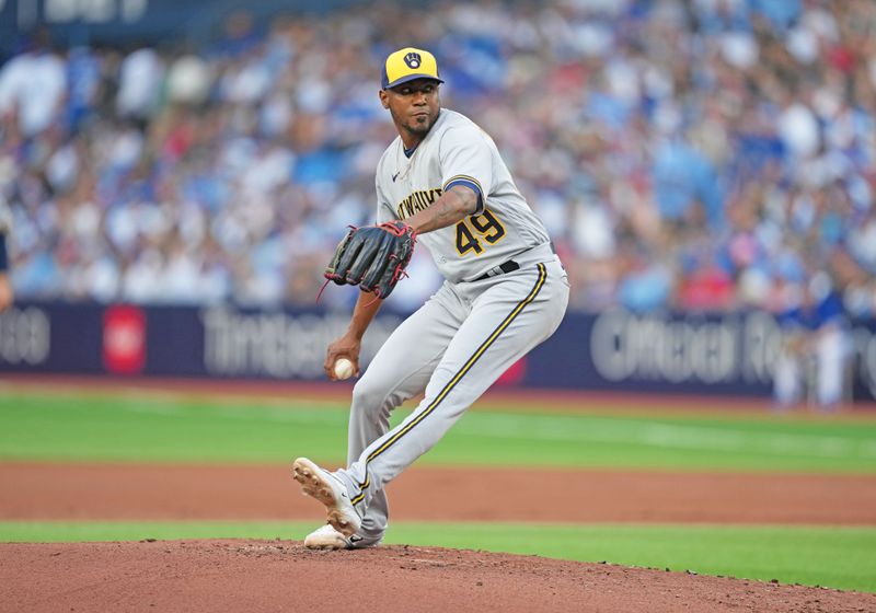 May 31, 2023; Toronto, Ontario, CAN; Milwaukee Brewers starting pitcher Julio Teheran (49) throws a pitch against the Toronto Blue Jays during the first inning at Rogers Centre. Mandatory Credit: Nick Turchiaro-USA TODAY Sports