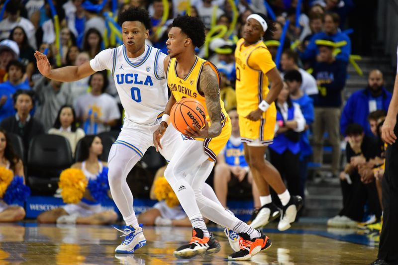 Mar 2, 2023; Los Angeles, California, USA; Arizona State Sun Devils guard Desmond Cambridge Jr. (4) moves the ball against UCLA Bruins guard Jaylen Clark (0) during the second half at Pauley Pavilion. Mandatory Credit: Gary A. Vasquez-USA TODAY Sports