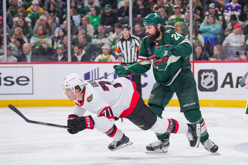 Apr 2, 2024; Saint Paul, Minnesota, USA; Minnesota Wild defenseman Zach Bogosian (24) checks Ottawa Senators center Ridly Greig (71) in the third period at Xcel Energy Center. Mandatory Credit: Brad Rempel-USA TODAY Sports