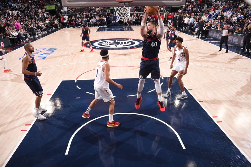 INGLEWOOD, CA - OCTOBER 23: Ivica Zubac #40 of the LA Clippers goes up for the rebound during the game against the Phoenix Suns on October 23, 2024 at Intuit Dome in Los Angeles, California. NOTE TO USER: User expressly acknowledges and agrees that, by downloading and/or using this Photograph, user is consenting to the terms and conditions of the Getty Images License Agreement. Mandatory Copyright Notice: Copyright 2024 NBAE (Photo by Juan Ocampo/NBAE via Getty Images)