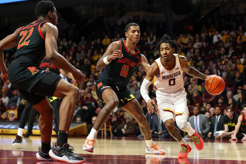 Jan 7, 2024; Minneapolis, Minnesota, USA; Minnesota Golden Gophers guard Elijah Hawkins (0) dribbles the ball towards the basket as Maryland Terrapins forward Julian Reese (10) defends during the first half at Williams Arena. Mandatory Credit: Matt Krohn-USA TODAY Sports
