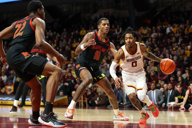 Jan 7, 2024; Minneapolis, Minnesota, USA; Minnesota Golden Gophers guard Elijah Hawkins (0) dribbles the ball towards the basket as Maryland Terrapins forward Julian Reese (10) defends during the first half at Williams Arena. Mandatory Credit: Matt Krohn-USA TODAY Sports