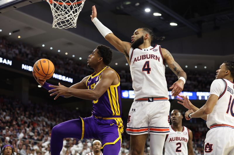 Jan 13, 2024; Auburn, Alabama, USA;  LSU Tigers guard Jordan Wright (6) moves past Auburn Tigers forward Johni Broome (4) for a shot during the first half at Neville Arena. Mandatory Credit: John Reed-USA TODAY Sports